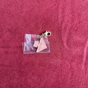 Prada “gift with purchase“ charm.